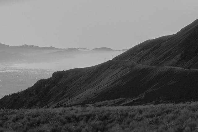A winding road through hills, ready for your next adventure